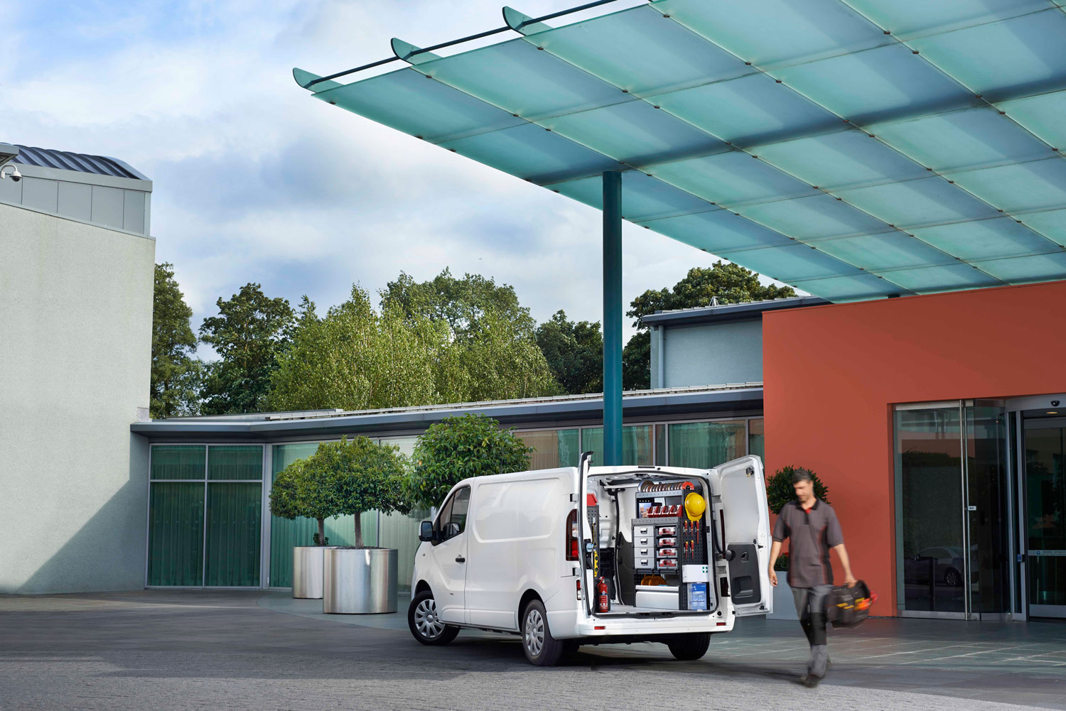 Electrician's van fitted out with modul-system van racking on the job